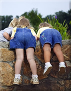 Children looking down the well